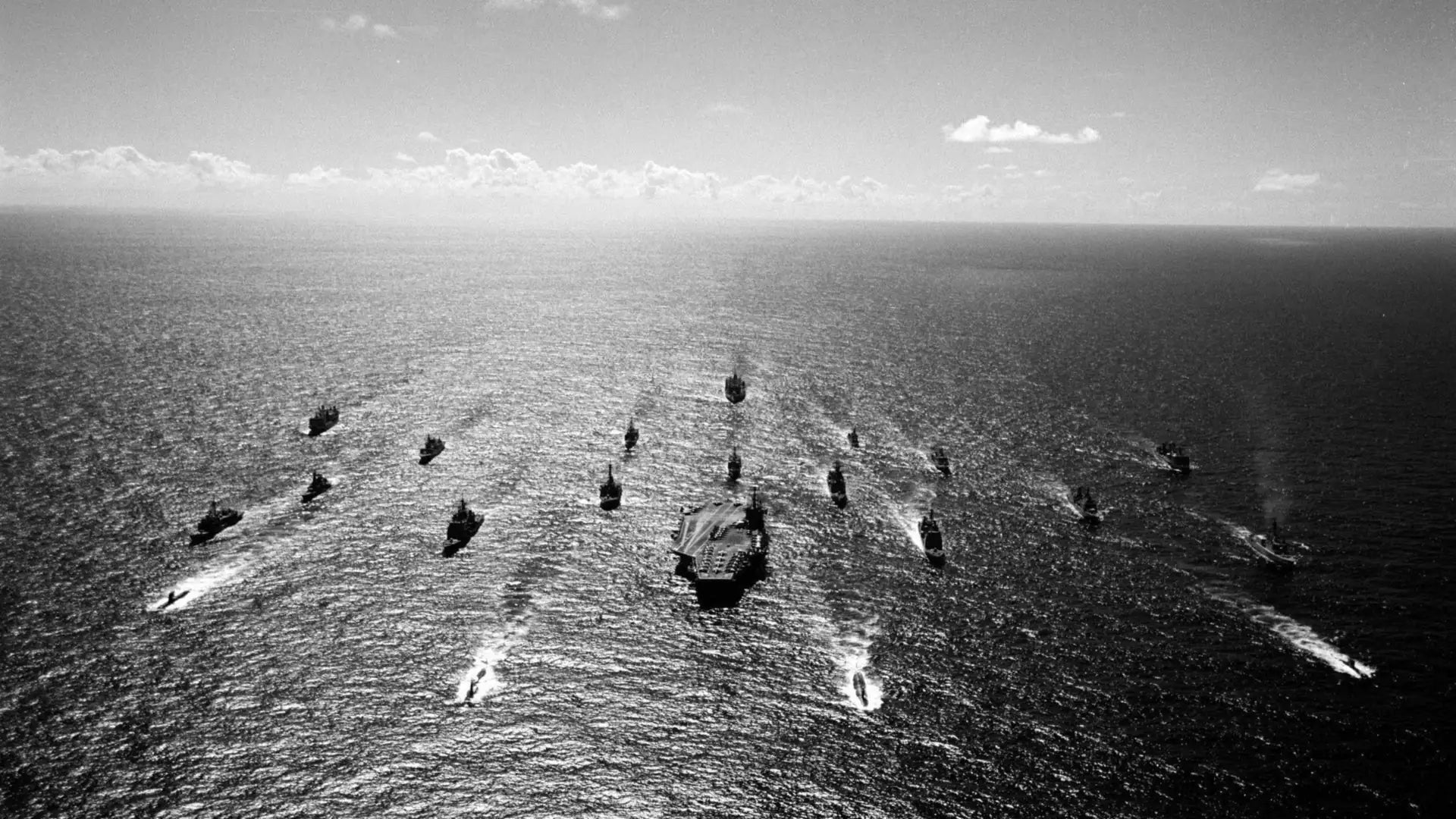 Navy carrier strike group underway in formation, aerial view